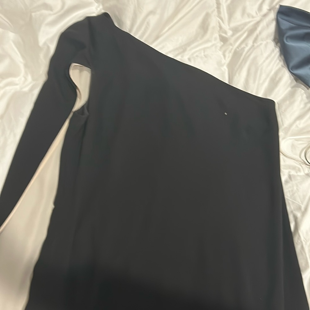 floor length black dress with drape on one shoulder and pop of white!
